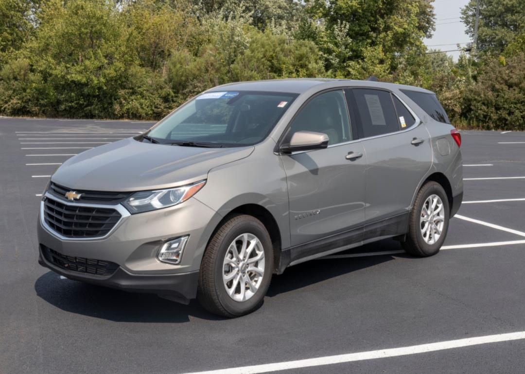 A gray Chevrolet Equinox in a parking lot.