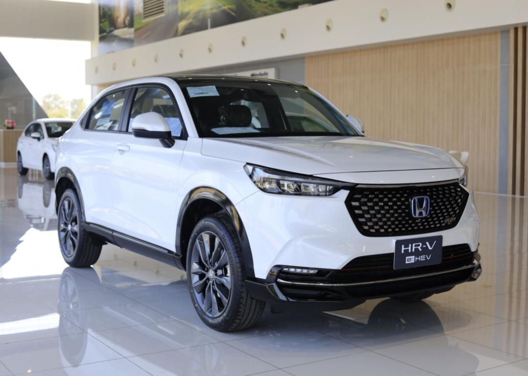 A white Honda HR-V in a showroom.