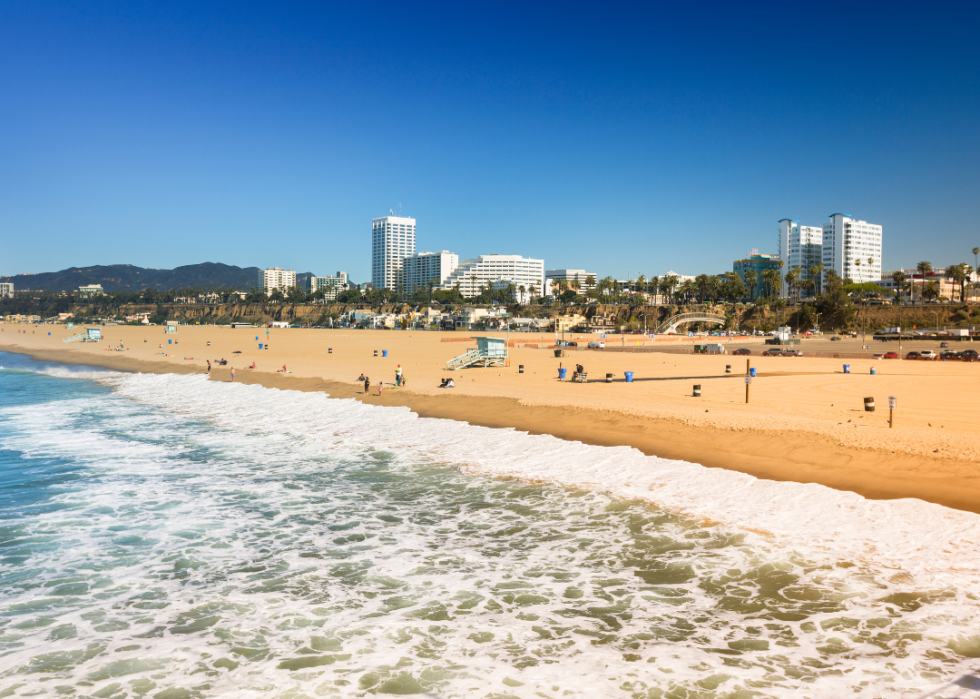 A view of a beach and buildings in the background.