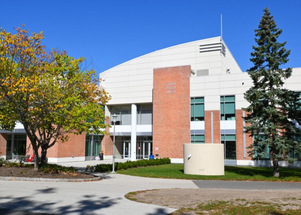 A modern red brick and white building.