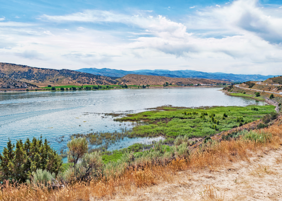 A lake with mountains in the background. 