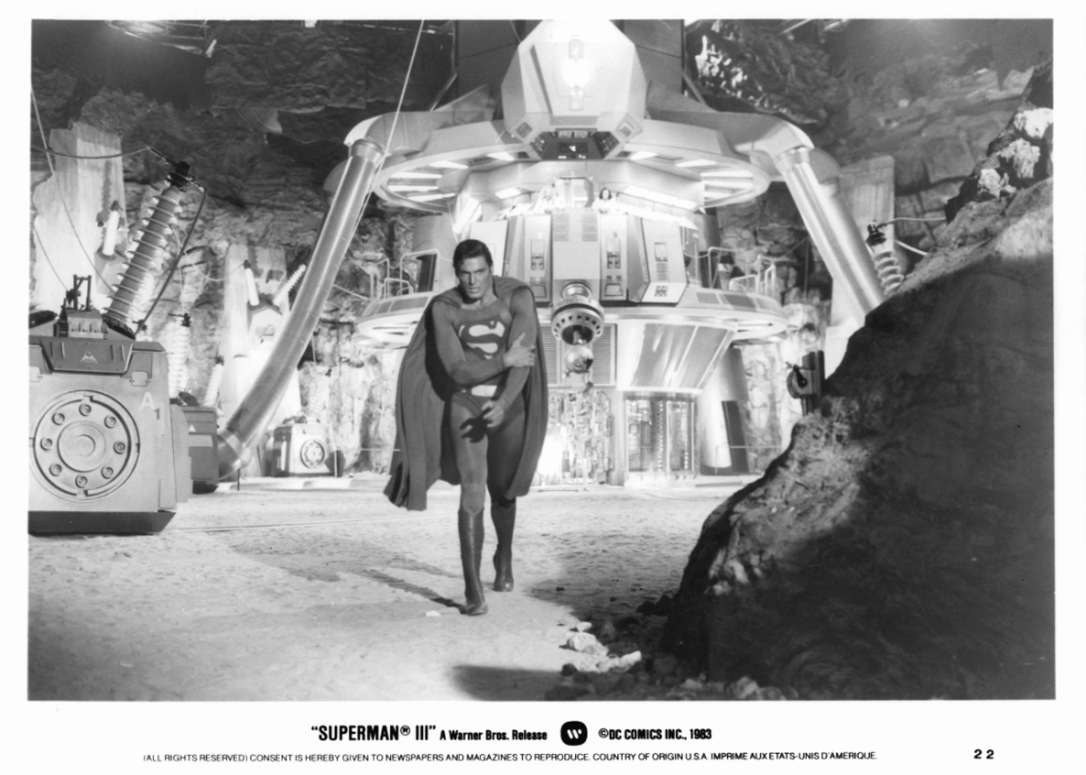 Christopher Reeve walking away from fortress holding his arm in a scene from the film 'Superman III', 1983.