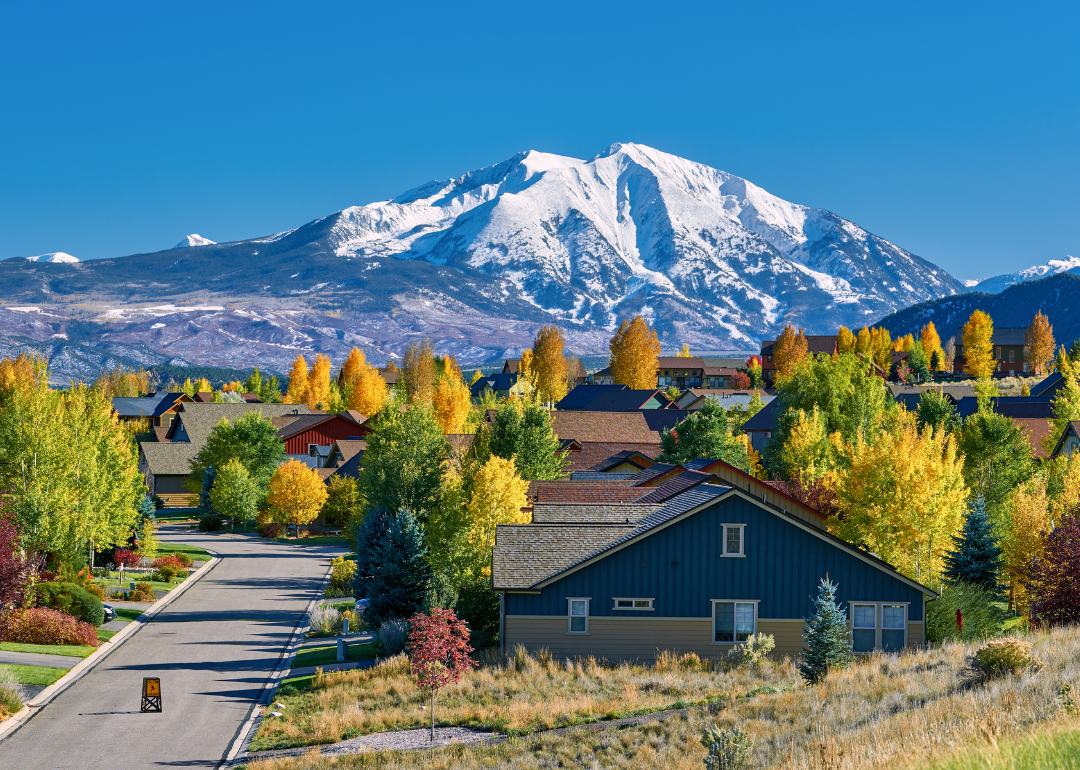 Large homes at the base of the mountains in Autumn.