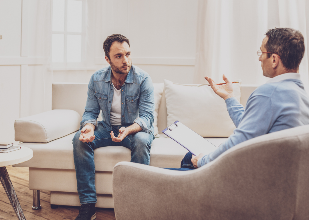 A psychologist and their patient talking during an appointment