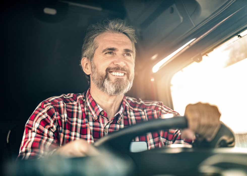 A truck driver driving a truck.