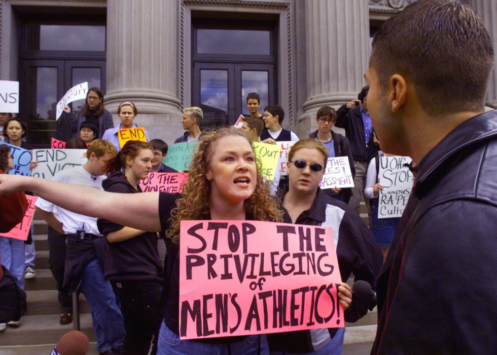 Students hold placards in protest at the University of Minnesota.