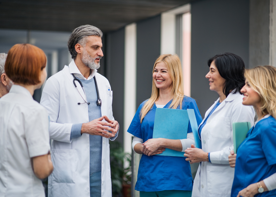 A group of hospital workers having a discussion.