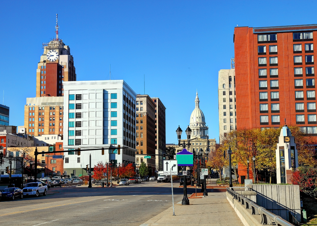 A street-level view of the Michigan State Capitol in downtown Lansing.