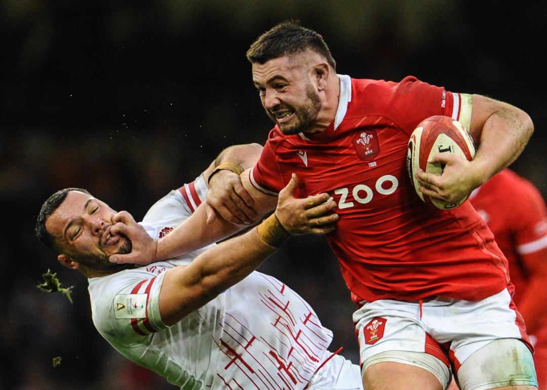 Gareth Thomas palming off Englands's Ellis Genge during the Six Nations Rugby match between Wales and England at Principality Stadium on February 25, 2023, in Cardiff, United Kingdom.