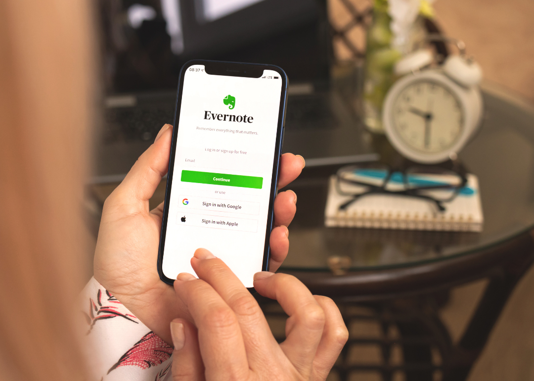 A person logging into Evernote on their phone to access their second brain.