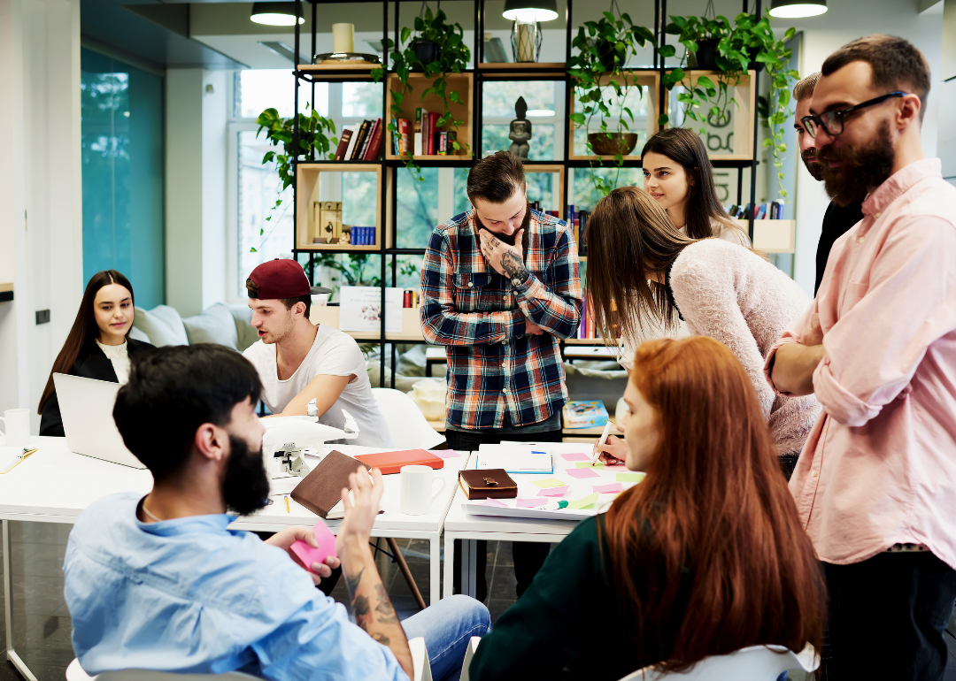 A group of young, engaged employees working together.