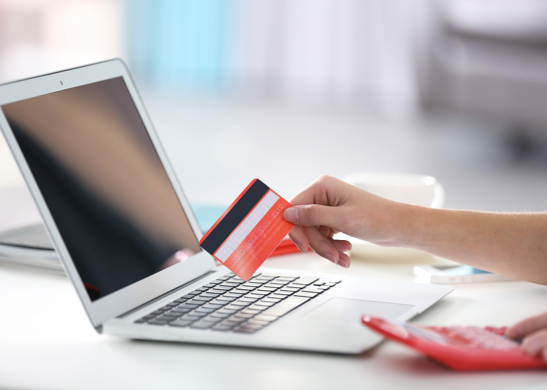A person paying online using their credit card.