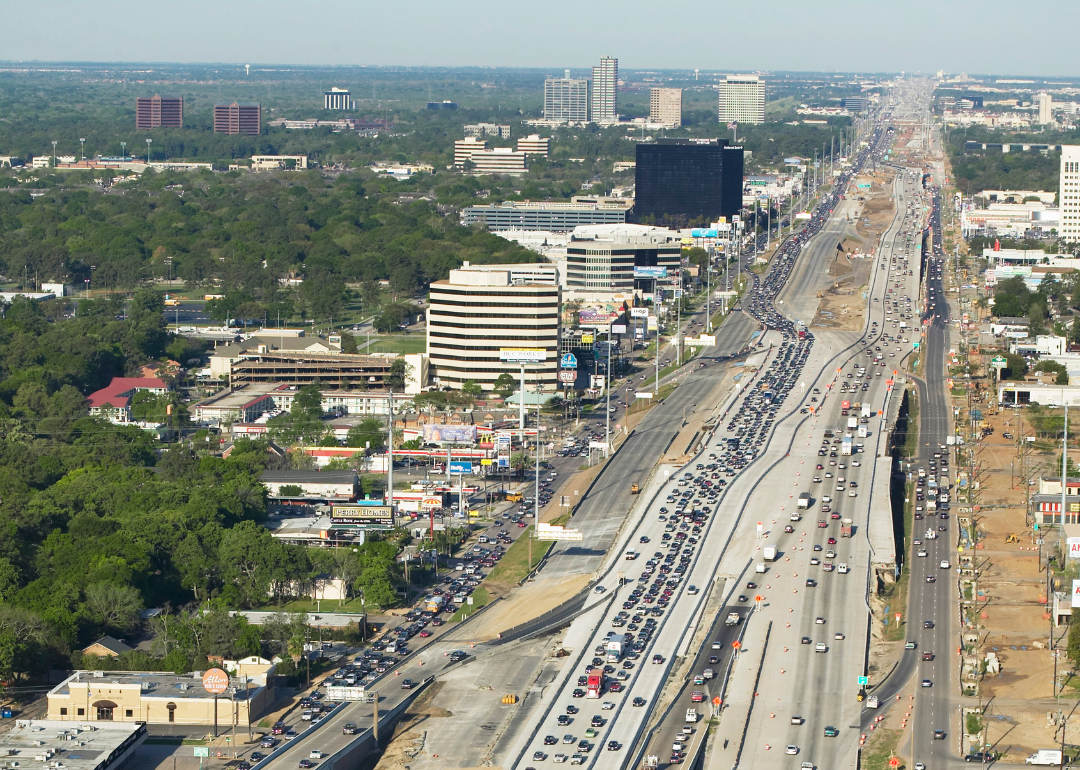 Cars driving down highway 610 in Houston.
