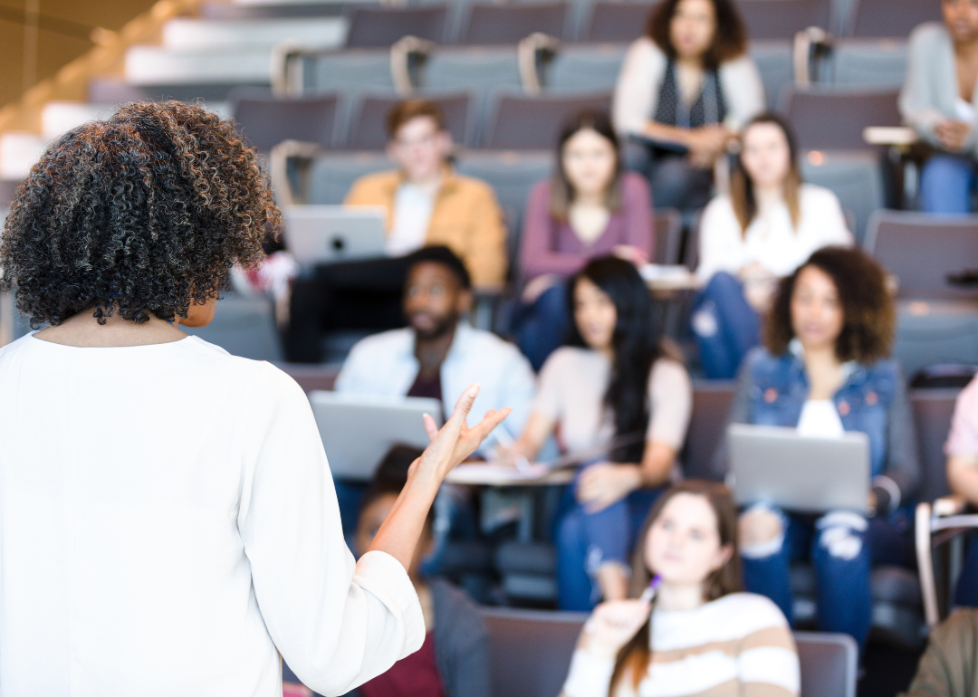 A teacher giving a lecture to a class of students.