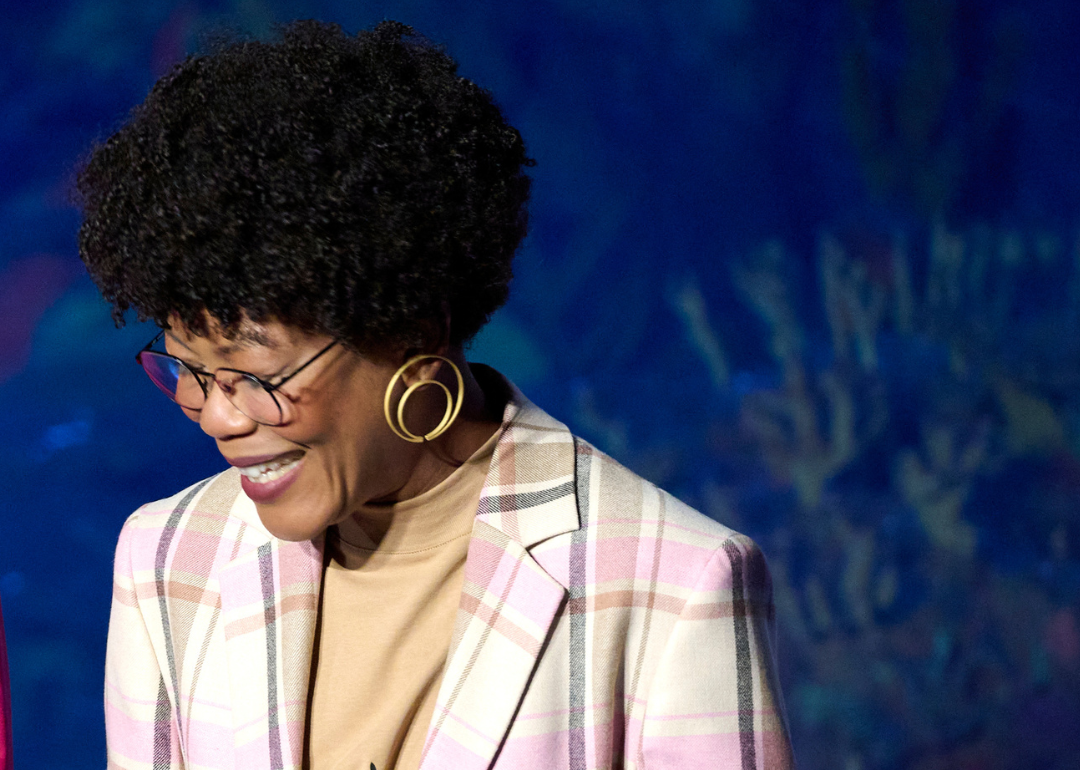 Angélica Dass smiling while onstage.