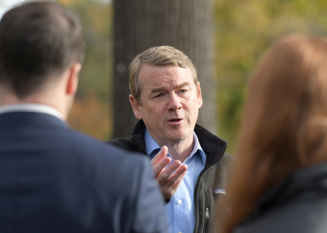 Sen. Michael Bennet answers questions from reporters after dropping off his ballot at Washington Park in Denver, Colorado on Wednesday, November 2, 2022.