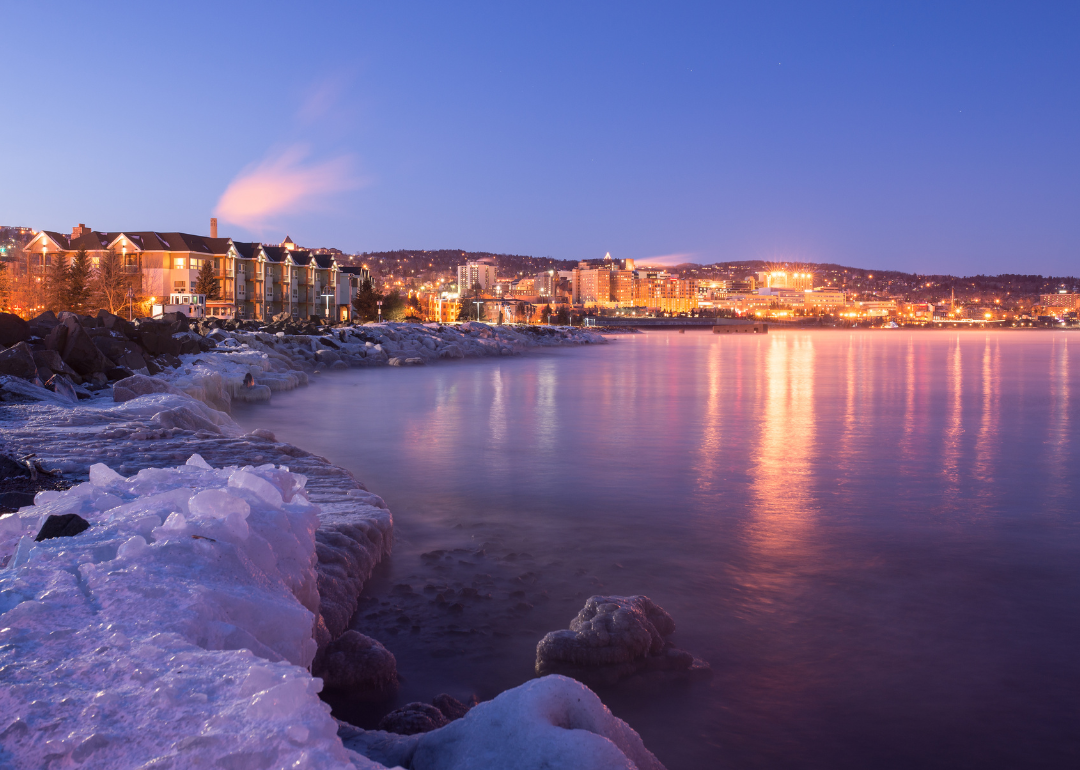 Homes along the lake in Duluth at night.