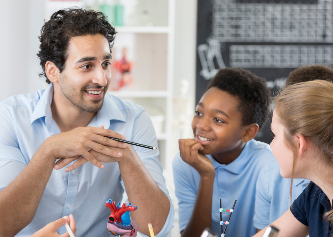 A middle school teacher with two students.