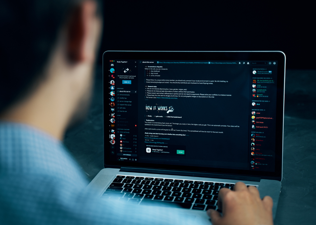 A person using Discord on their laptop.