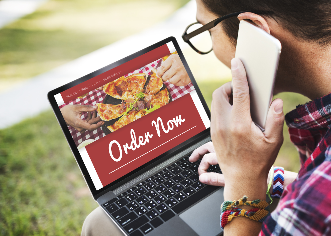 A person ordering pizza using their phone.