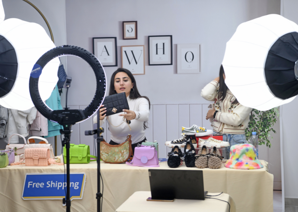 A livestreamer selling handbags via TikTok 