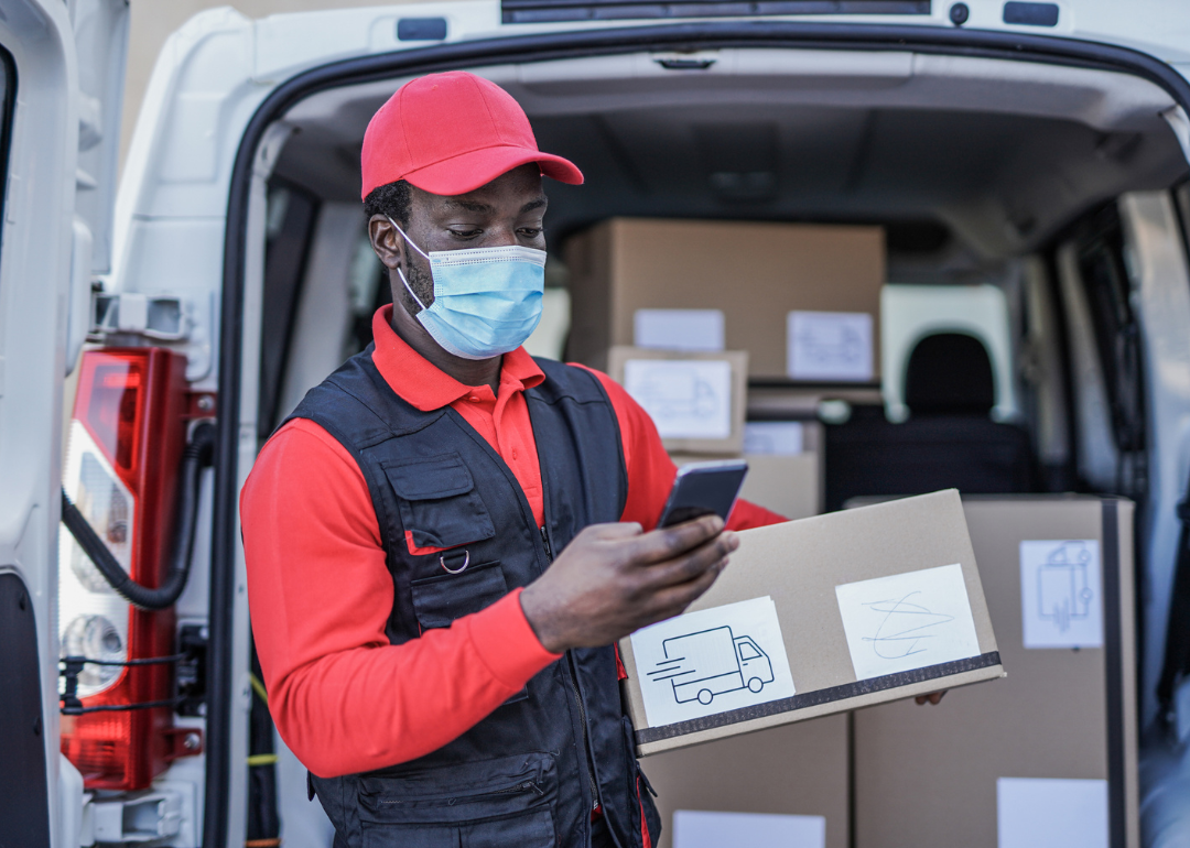 A delivery person using a mobile device to track their location