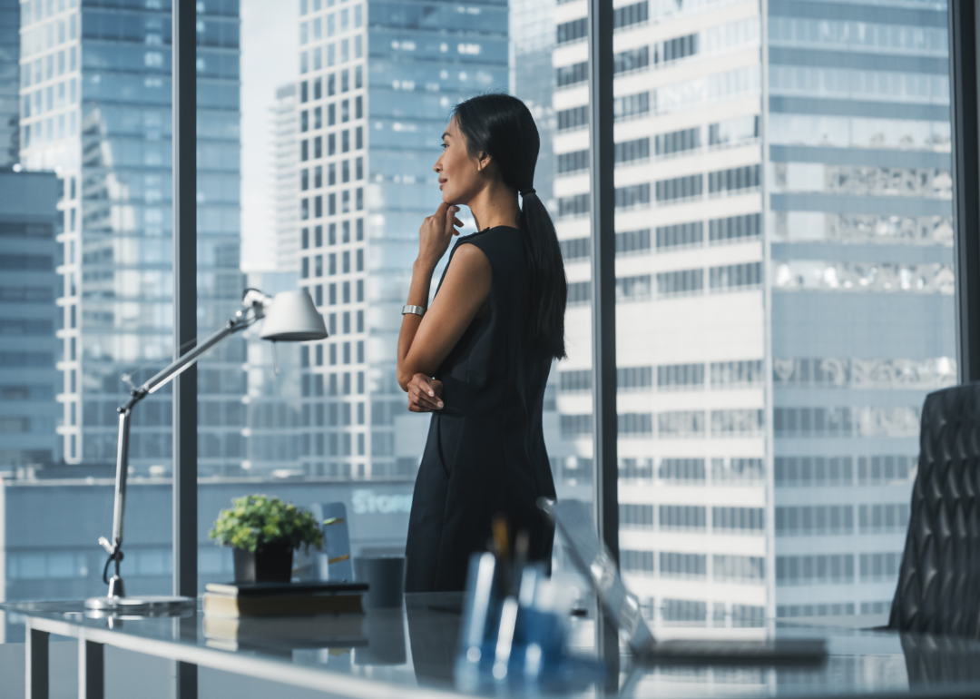 Woman executive talking on the phone in her office.