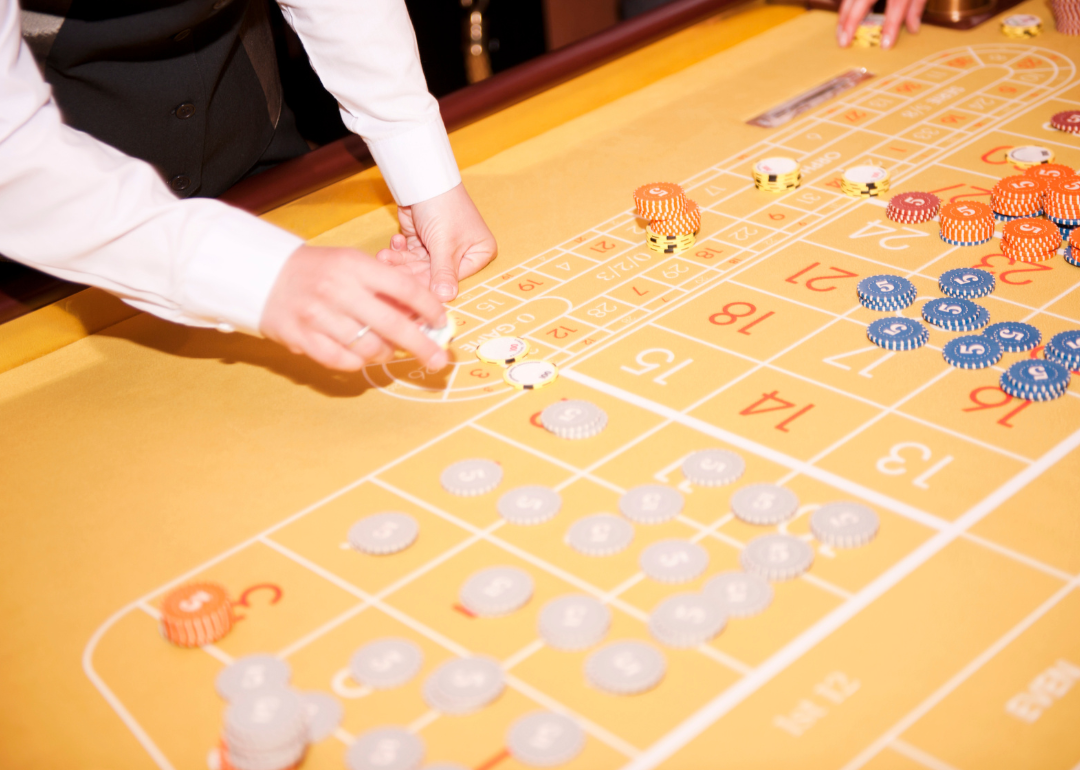 A dealer running a table at a casino.