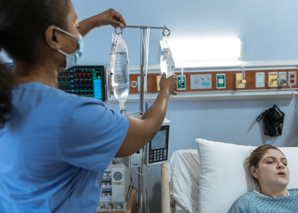 A nurse speaking to a patient