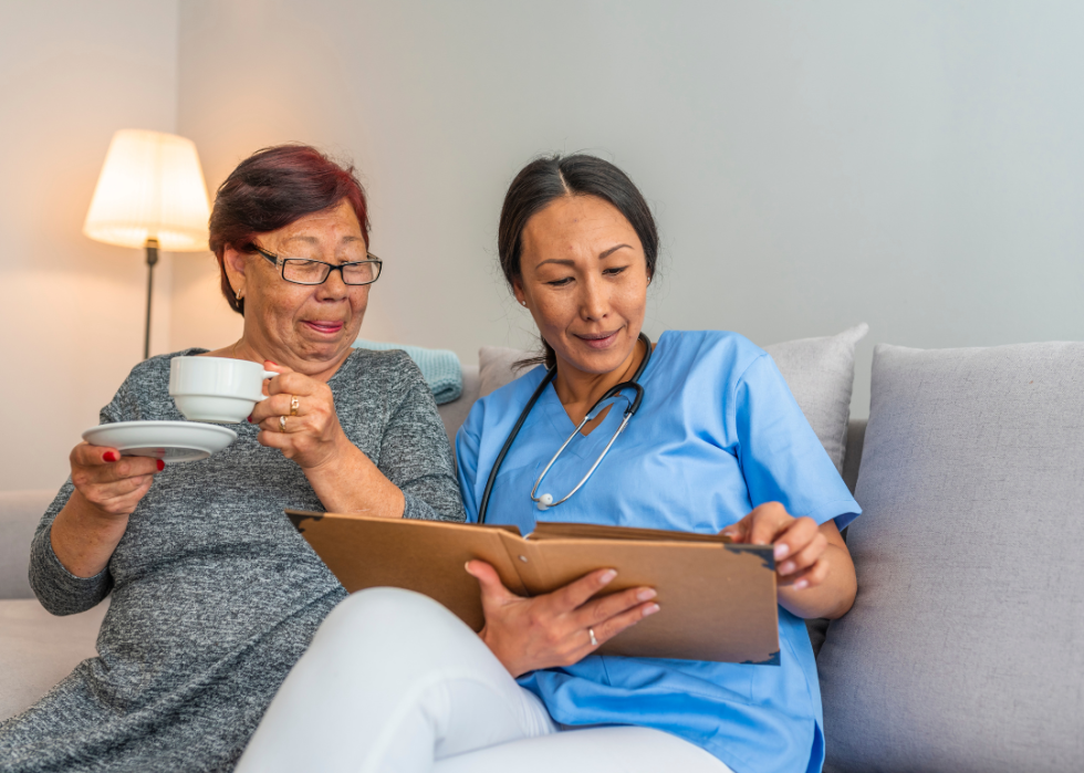 A nurse helping an elderly patient