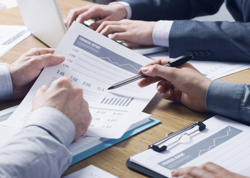 Businesspeople analyzing a financial report