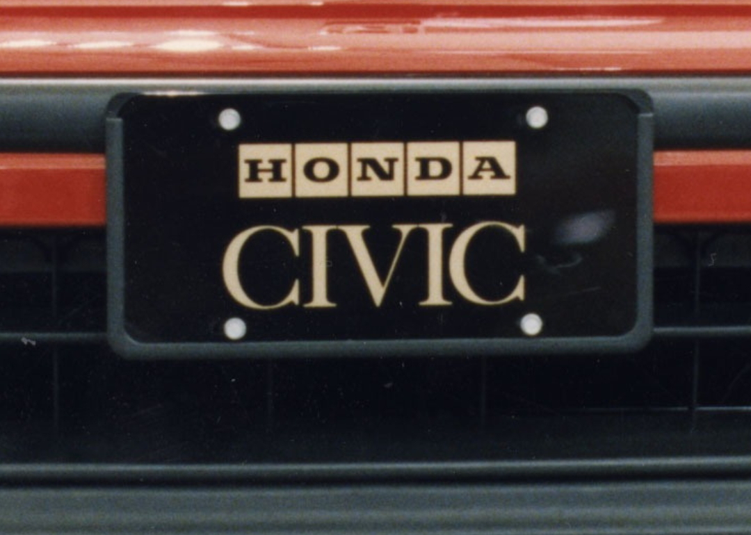 A closeup of a Honda Civic's license plate.