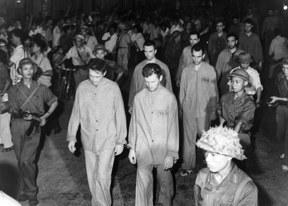 American airmen, captured by North Vietnamese forces during the Vietnam War, being paraded through the streets of Hanoi, Vietnam, on July 6, 1966.