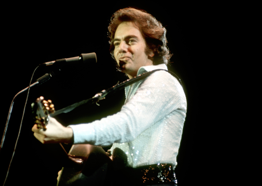 Neil Diamond performing on stage circa 1977.