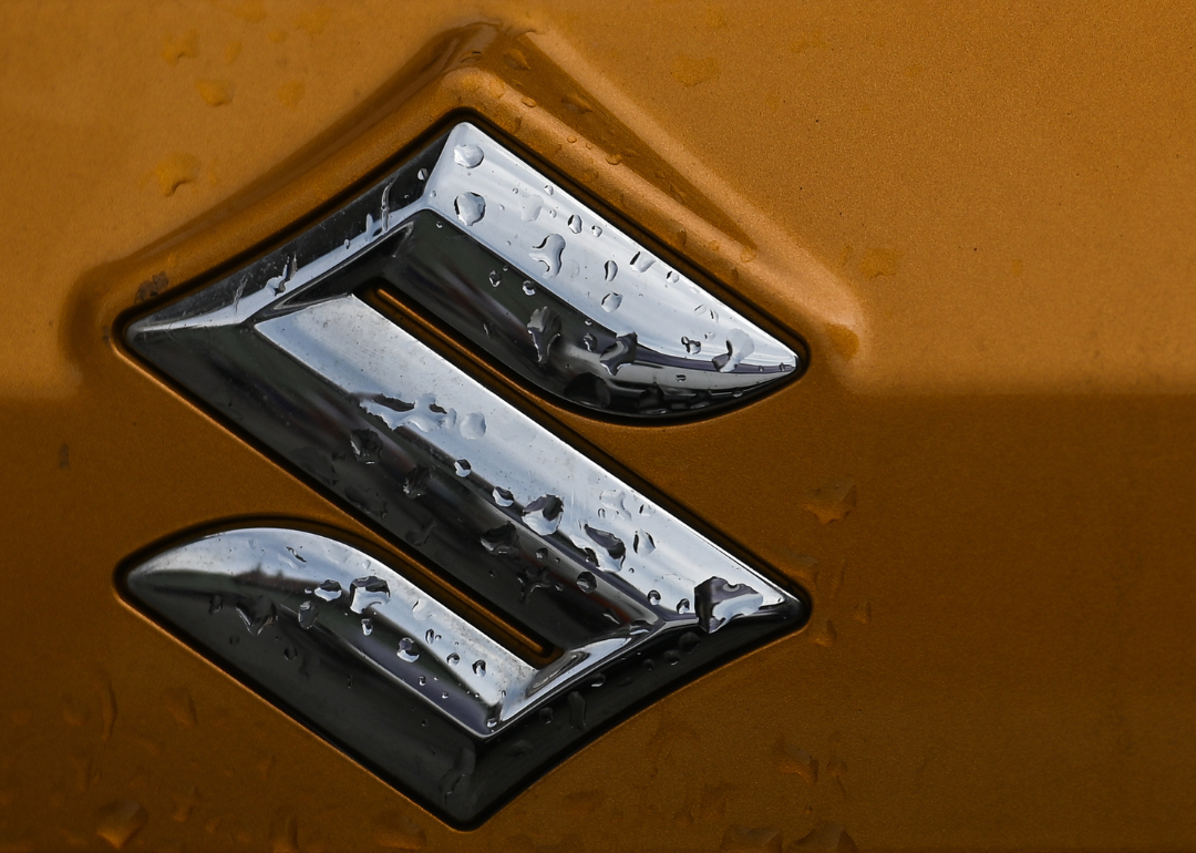 Th Suzuki logo as seen on a Suzuki vehicle parked in Krakow's Old Town