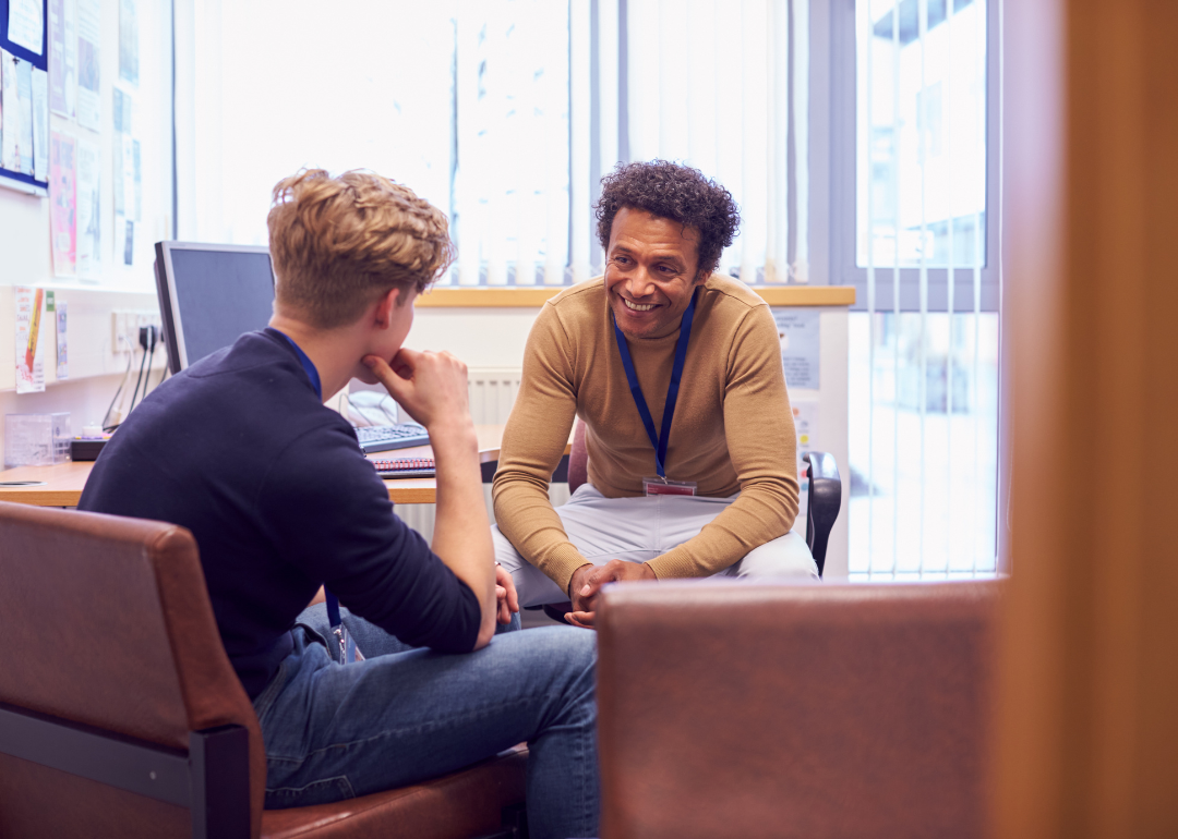 A school counselor meeting with a student