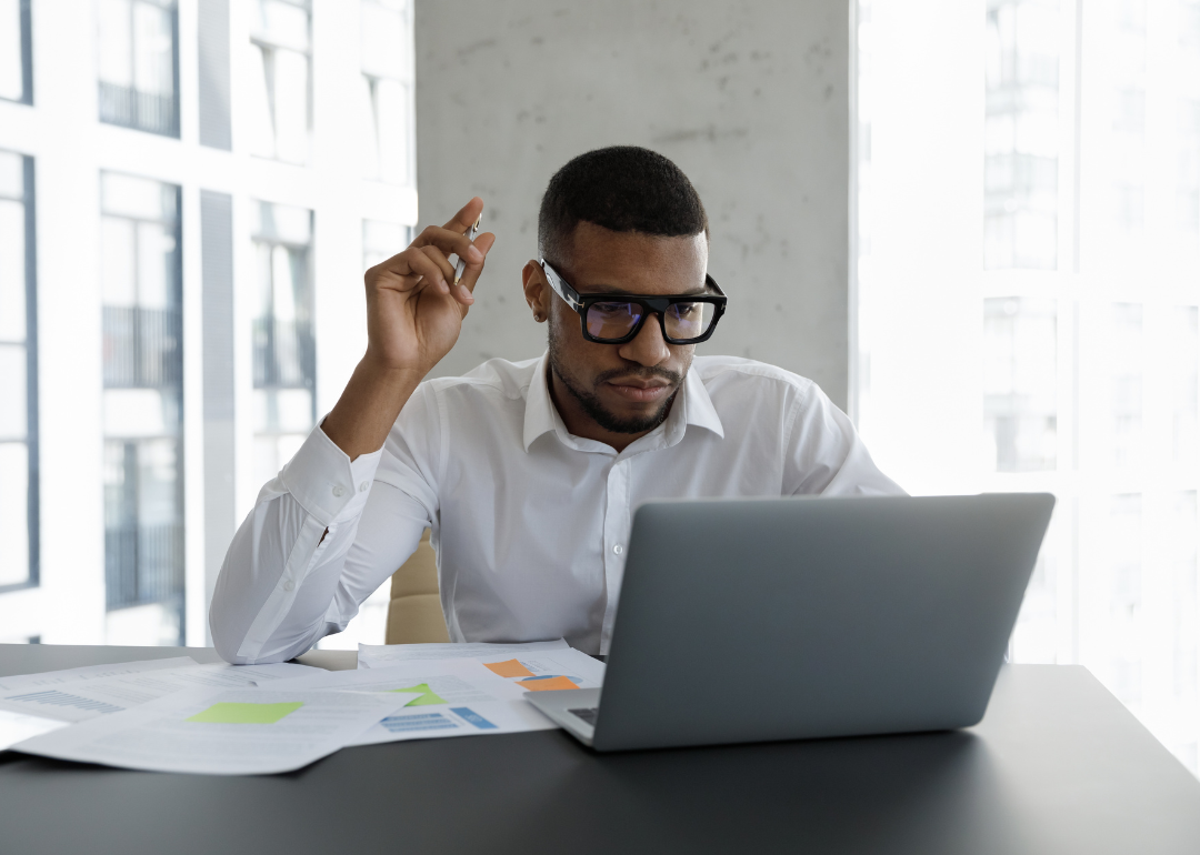 A financial risk specialist working in their office