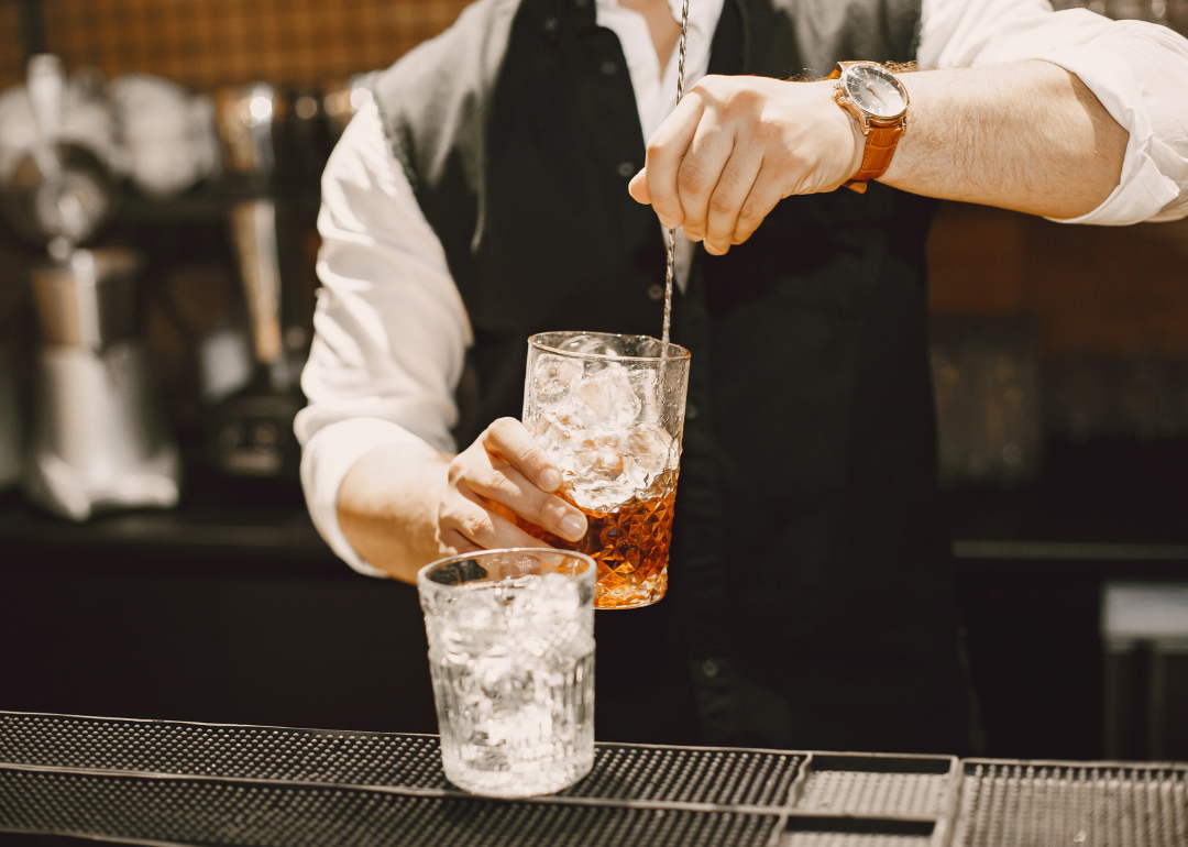A bartender preparing a drink.