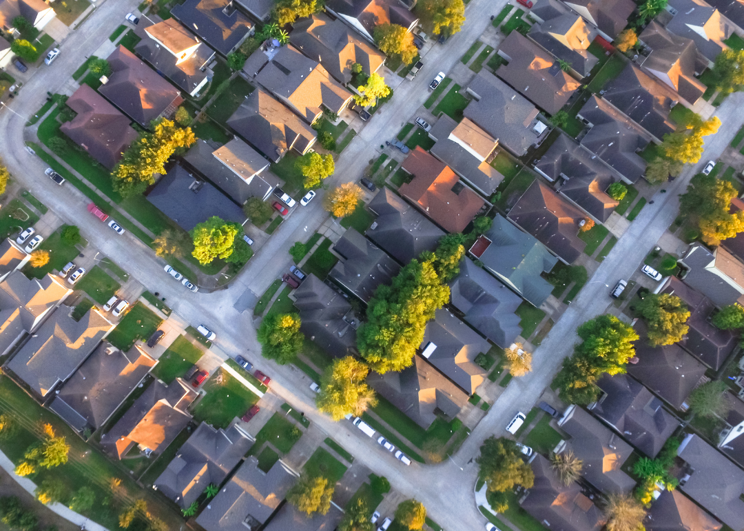 An aerial view of residential homes and driveways in a Houston neighborhood.