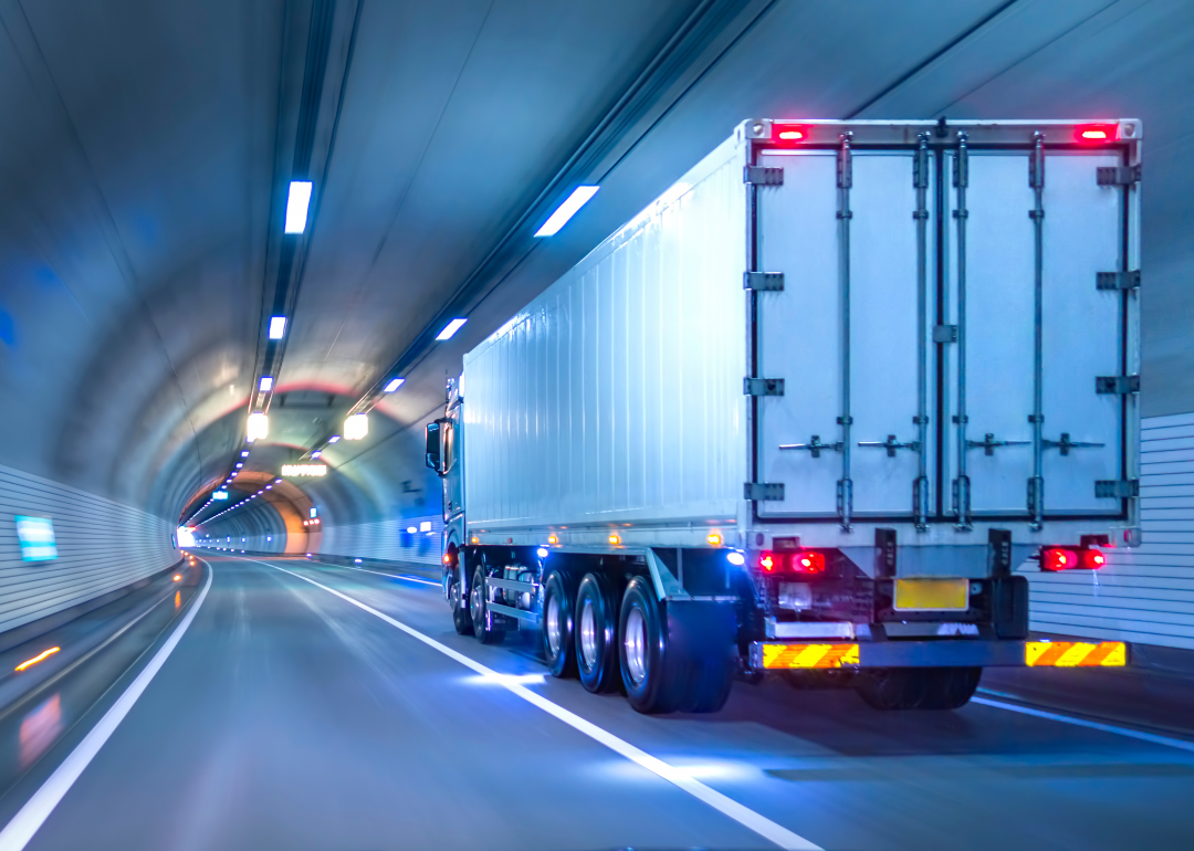 A truck driving through a tunnel.