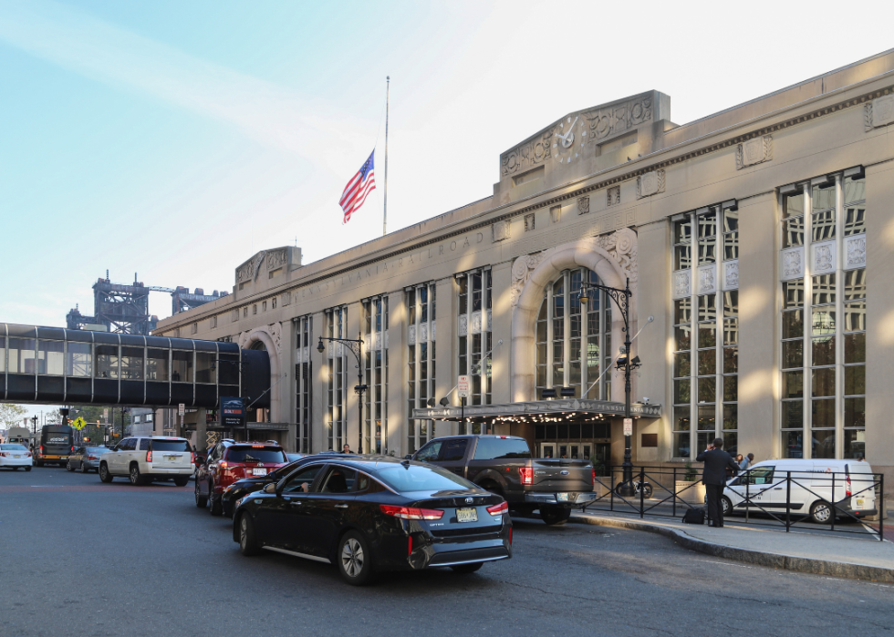 Cars and people outside the entrance to Newark Penn station in Newark, New Jersey