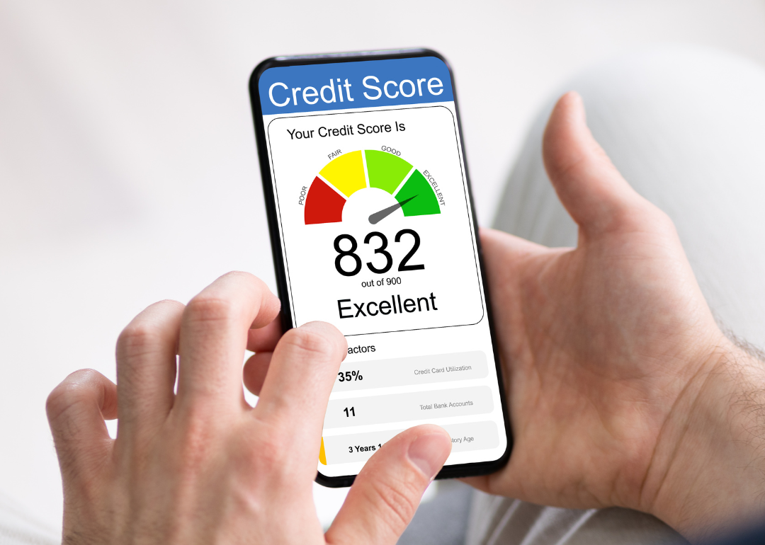 A person looking up their credit score, which is 832