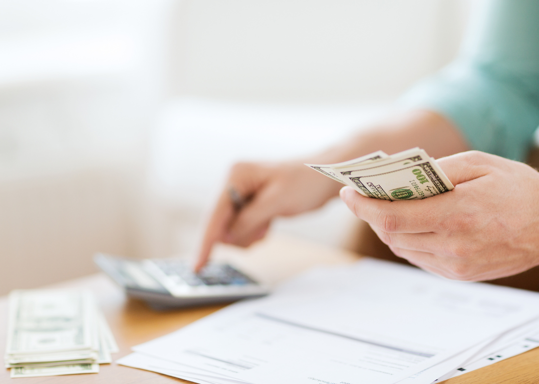 A person setting money aside for a car down payment