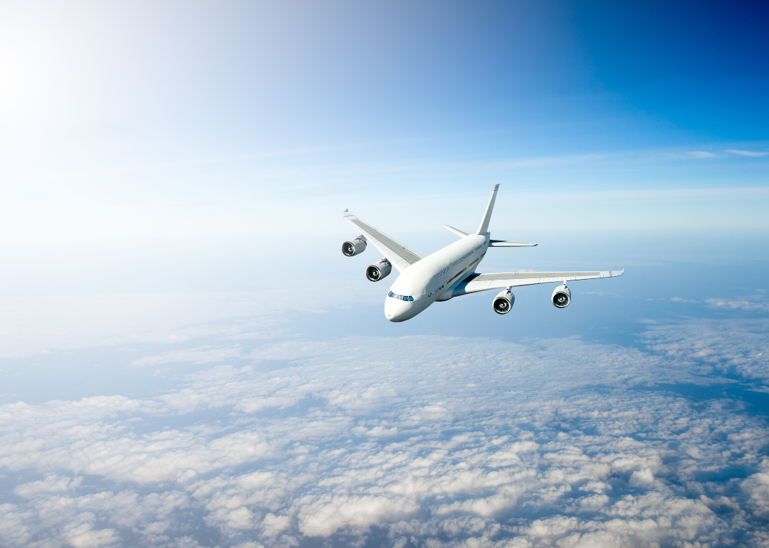 A plane flying at midday.