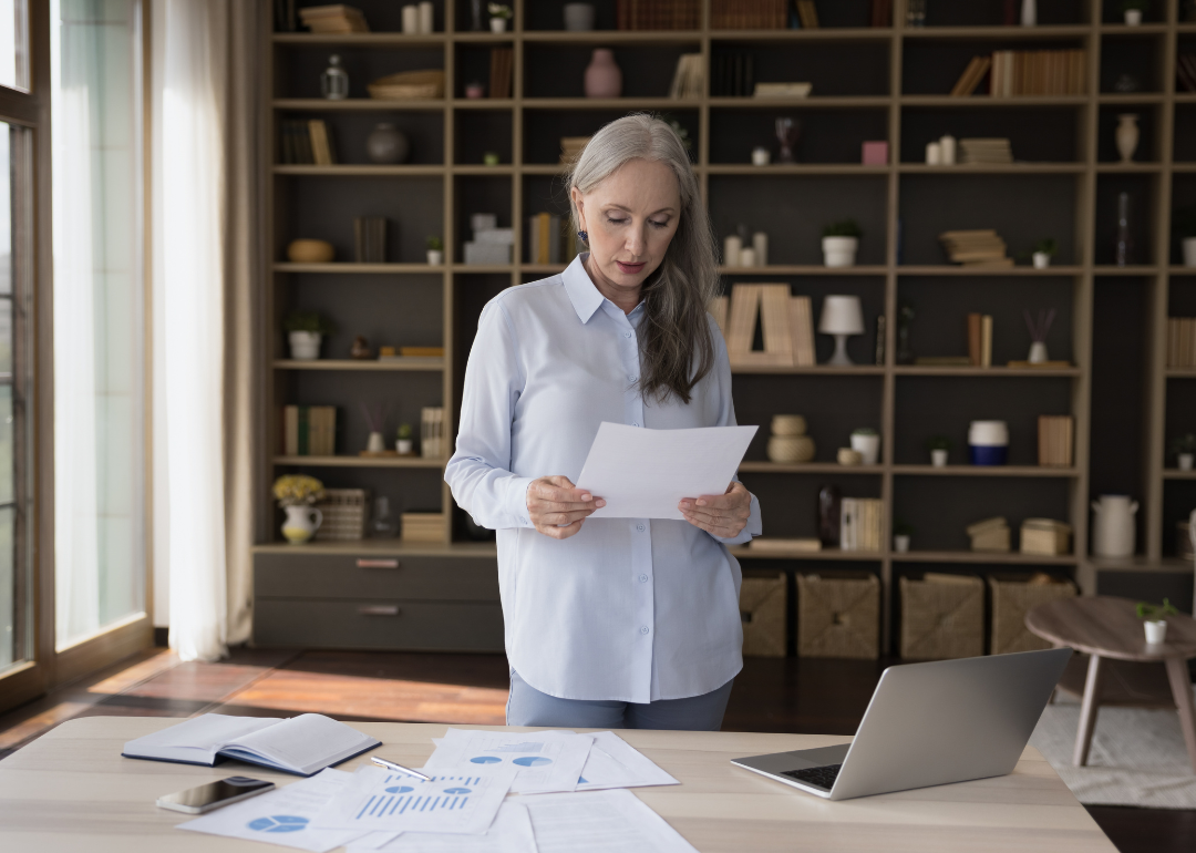 A budget analyst standing in their home office