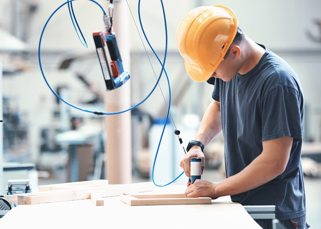 A person working in a furniture factory.