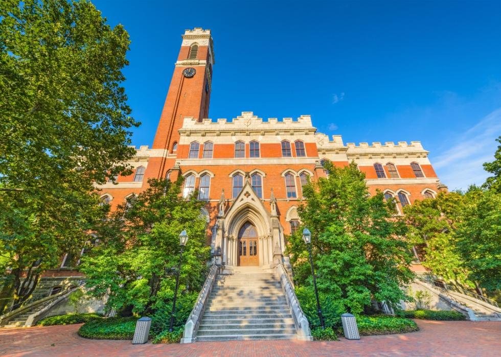 A stone building with a clocktower on the Vanderbilt campus.