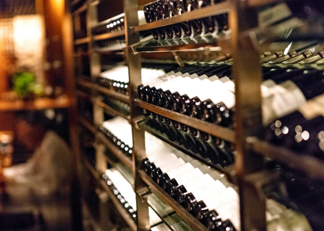 Rows of red wine bottels in a wine cellar