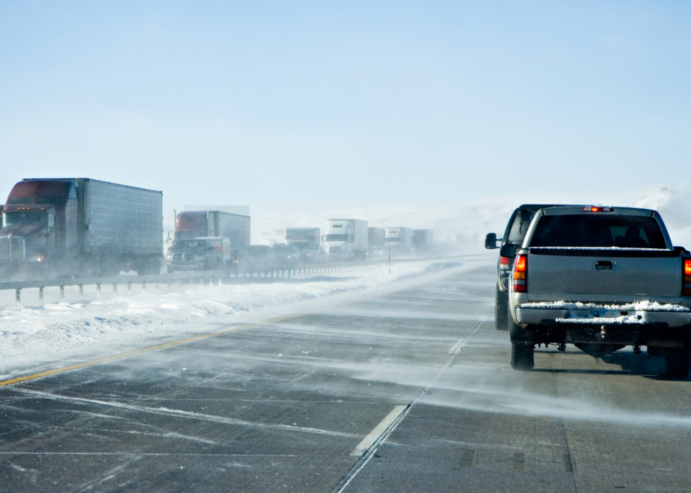 Traffic jam on roads with drifting snow.