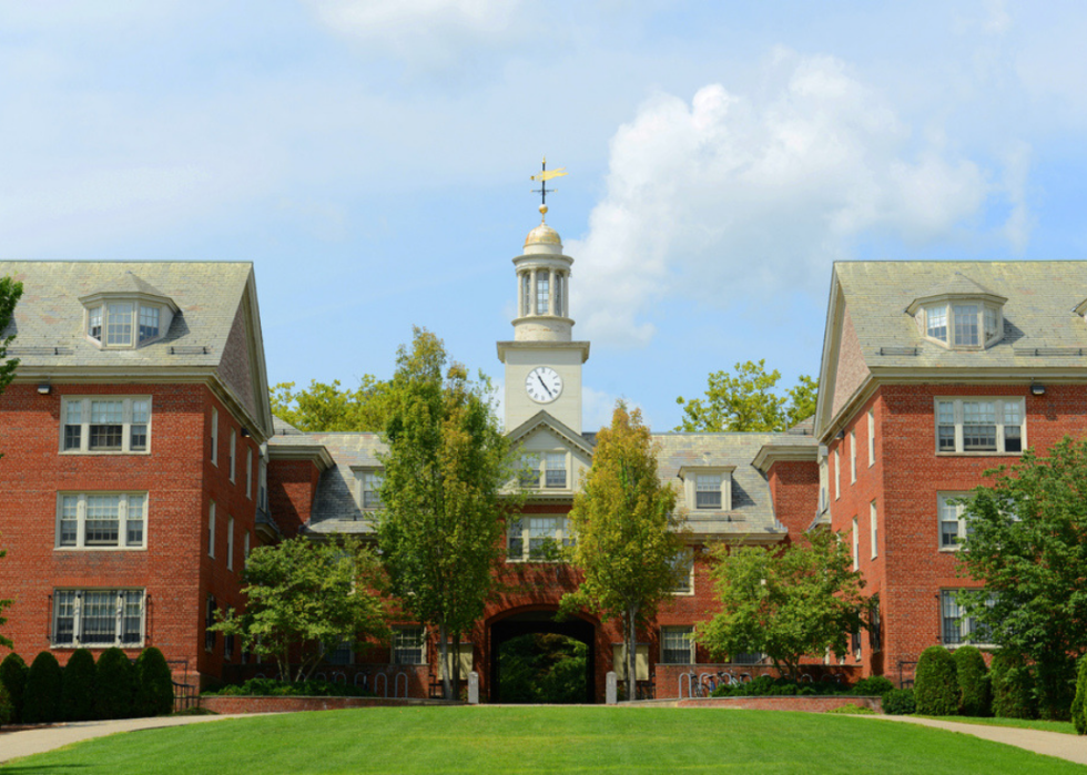 A red brick building with a clocktower.